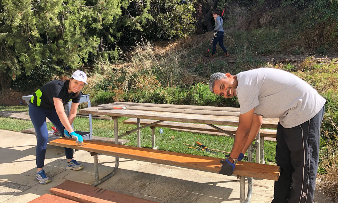 volunteers working on a bench